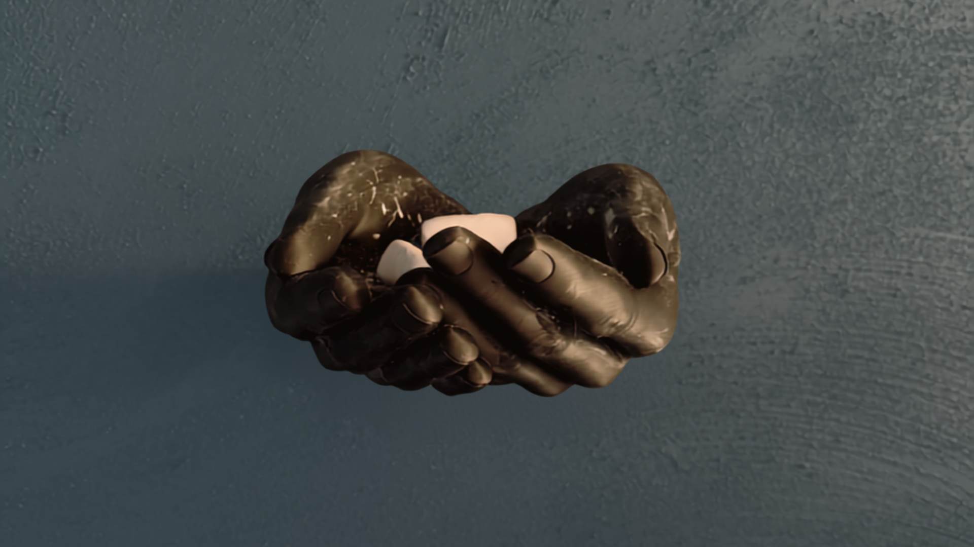 Chalked hands gripping a barbell during a training session at AD Studio